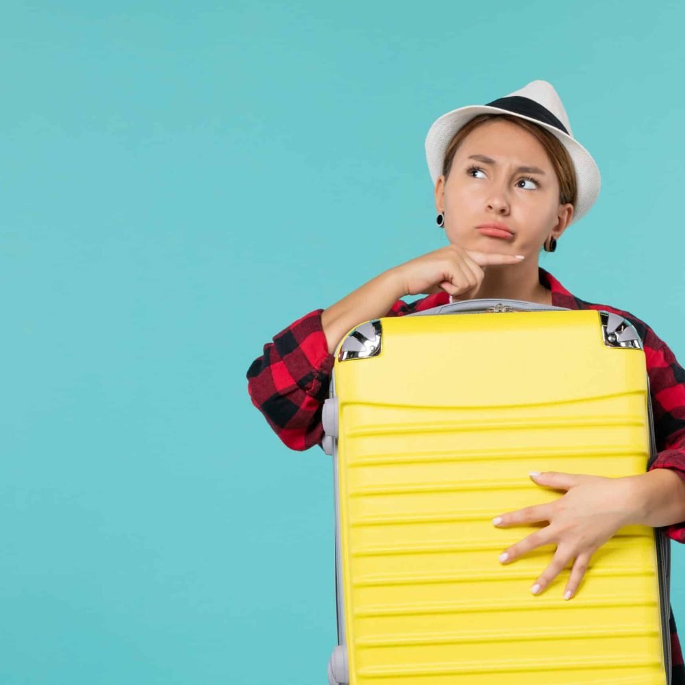 front-view-young-female-going-vacation-with-her-big-bag-blue-space