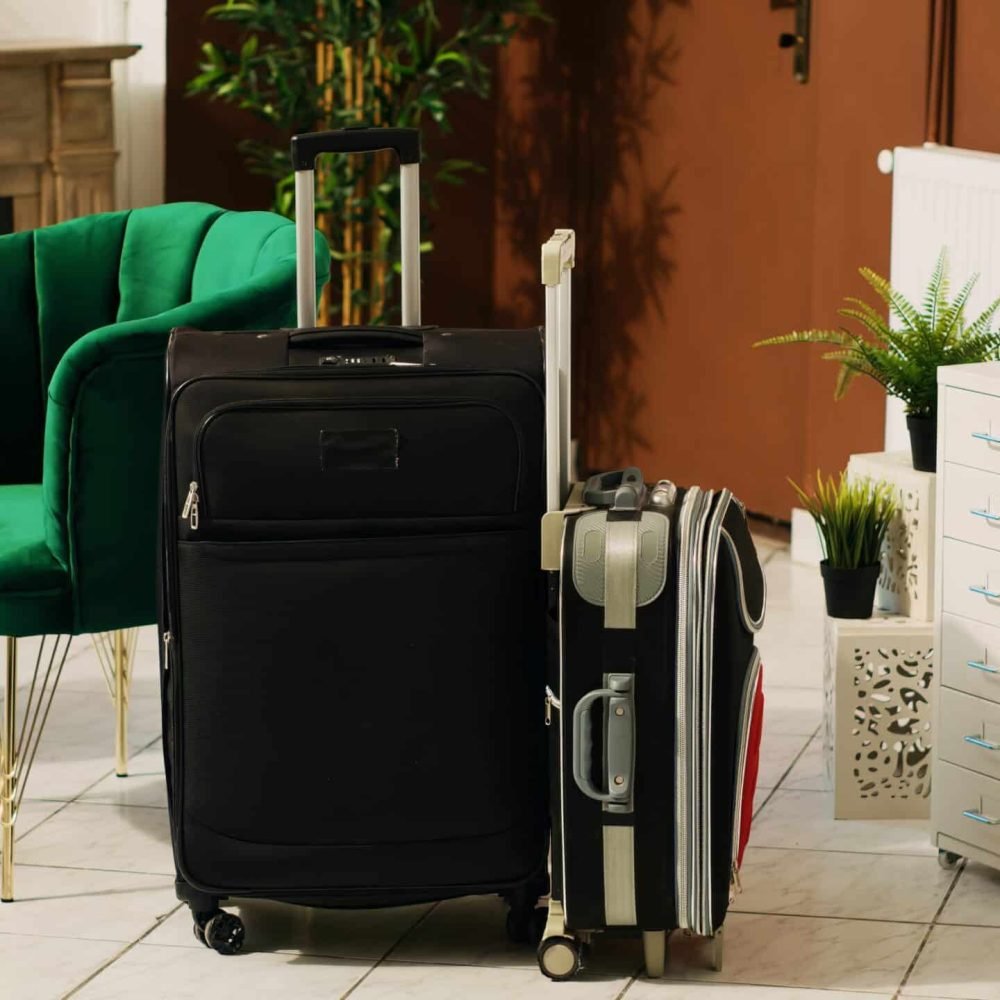 Trolley bags baggage in hotel reception and lounge area, clients luggage and modern decorations at resort front desk. Luxurious furniture at hotel reception entrance, registration.